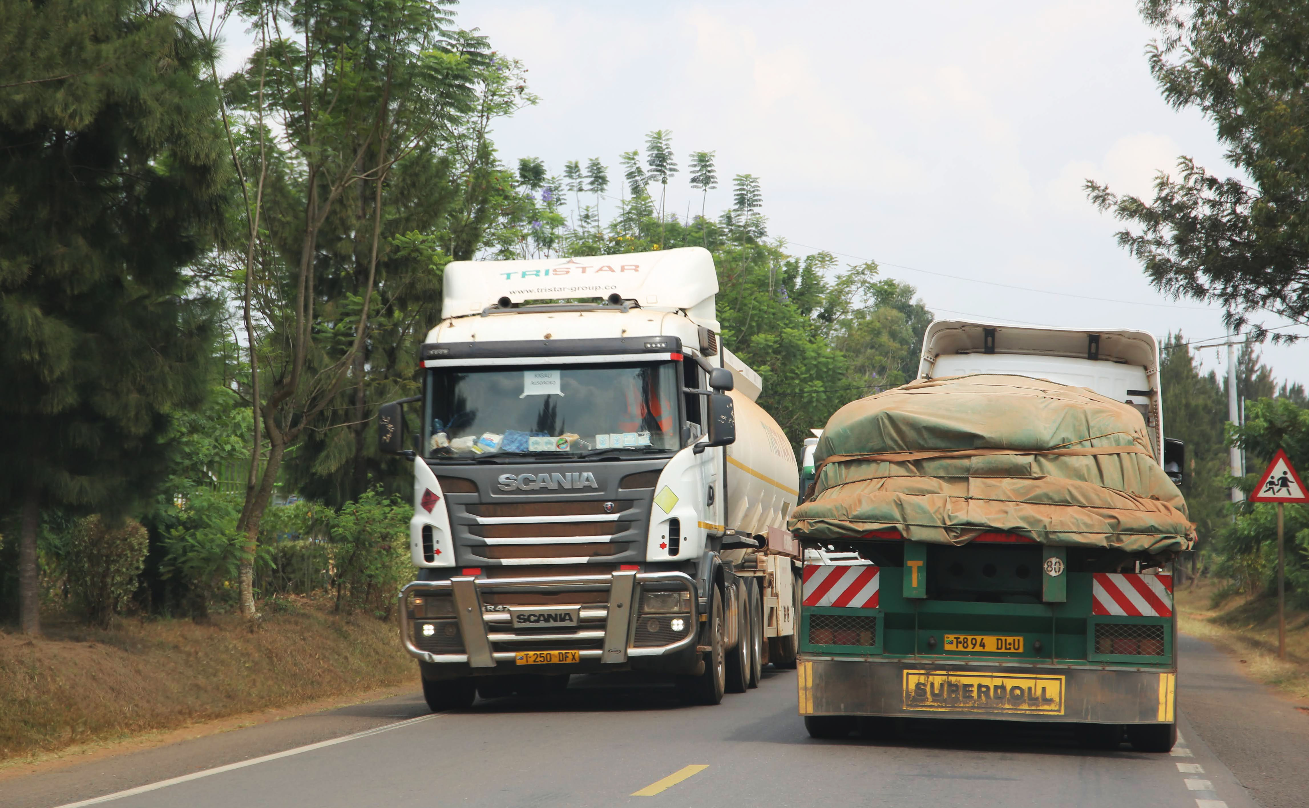 Cross-border cargo trucks from Tanzania to Rwanda. Businesses decry extra charges on cross-border trucks clearance. 