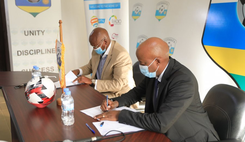 Arthur Asiimwe (R), Managing Director of the national broadcaster (RBA), and Ferwafa President Jean-Damascene Sekamana sign the three-year deal at Ferwafa headquarters on Tuesday. / Courtesy