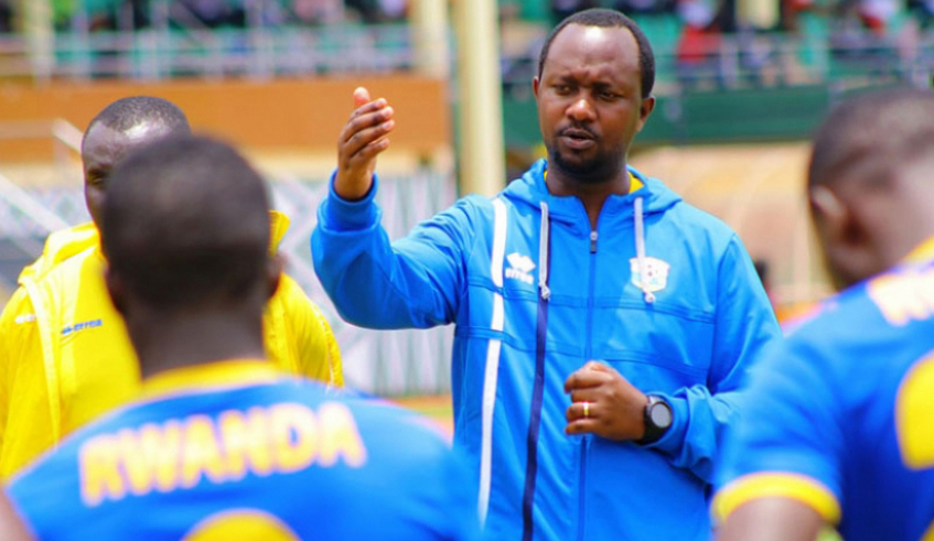 Vincent Mashami, head coach of the national team Amavubi, speaks to players after a past training session at Kigali Stadium. / File