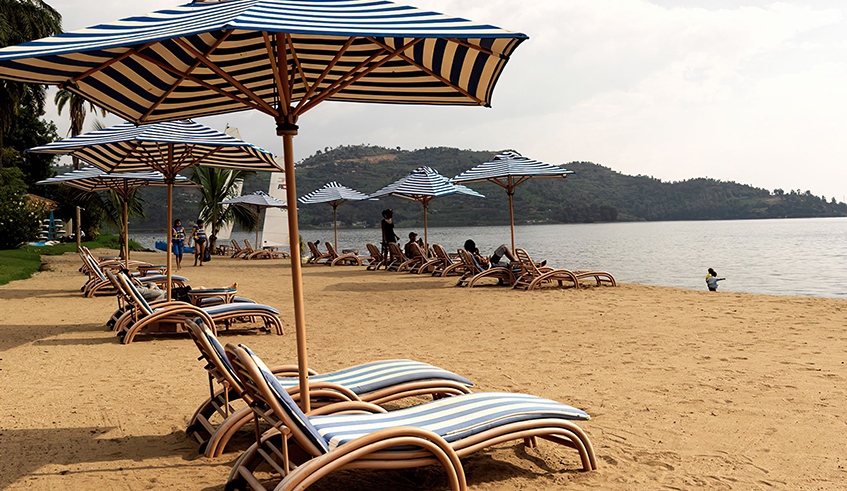 Holidaymakers relaxing on the shores of Lake Kivu in Rubavu town. District authorities want to create diversity in tourism products in the resort city to attract more tourist and also ensure they stay longer. / Photo: Courtesy.