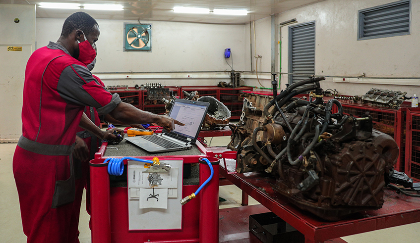 Technicians use a computer to diagnose and reprogram Toyota vehicles using a computer with direct link to the manufacturerâ€™s support team for real time support.