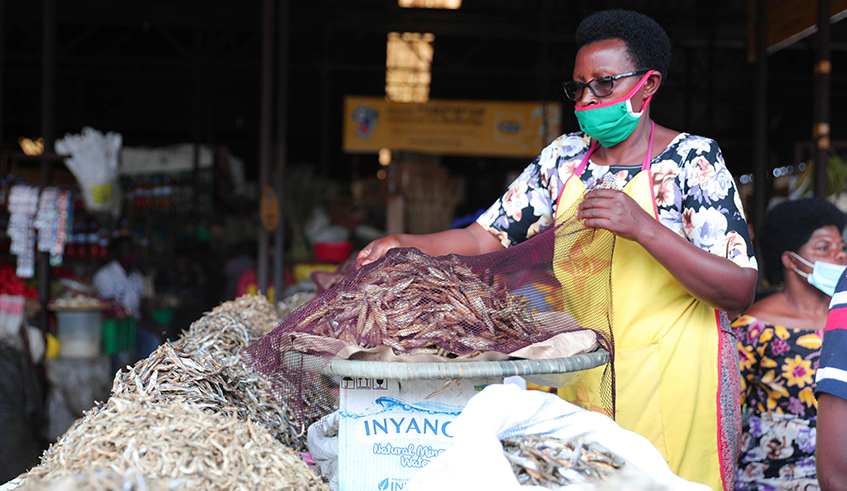 A u2018sambazau2019 vendor at Kimironko market in Kigali on November 4. / Photo: Craish Bahizi.