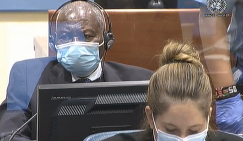 Genocide suspect Fu00e9licien Kabuga (behind) in the dock at theu00a0International Residual Mechanism for Criminal Tribunals in the hague, Nethlerlands on Wednesday, November 11, at the start of hearing in which he faces seven accounts of genocide related crimes. /  Photo: Courtesy. 