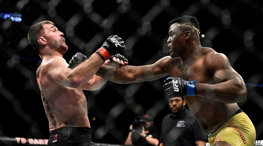 Francis Ngannou (R) has won 10 of his career 15 victories by knockout. 