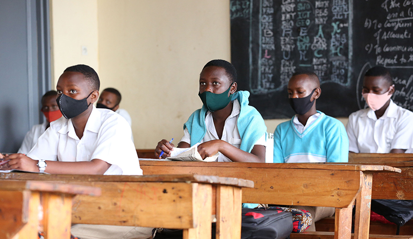 Students wear facemasks during class at Groupe Scolaire Remera Protestant in Gasabo District. Local manufacturers are targeting the reopening of schools as a market that would sustain over 2.7 million facemasks. / Photo: Dan Nsengiyumva.