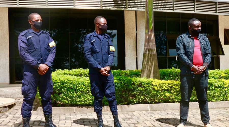 The two police officers and a civilian were paraded at Kigali Metropolitan Police headquarters in Remera. 