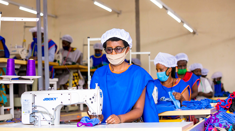 Workers make face masks inside Weya Creations garment factory in Kigali. Despite the high demand for face masks to control the spread of the virus, garment factories are among businesses that were hit hard by Covid-19. 