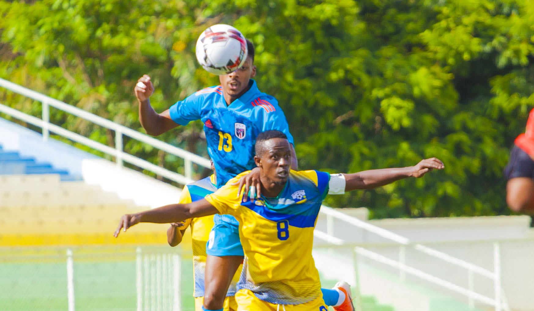 Team Captain Haruna Niyonzima tries to head the ball with Cape Verde midfielder Jeffrey Fortes during a goalless draw  at Kigali stadium