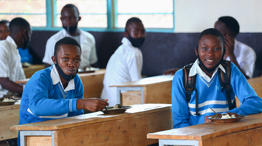 Students take lunch as part of the school feeding programme at Groupe Scolaire Kimironko on November 16. 