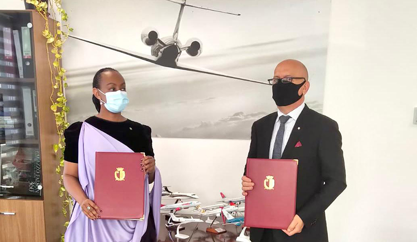 High Commissioner Yamina Karitanyi and Captain Charles Pace, Director General for Civil Aviation of Malta, sign MoU