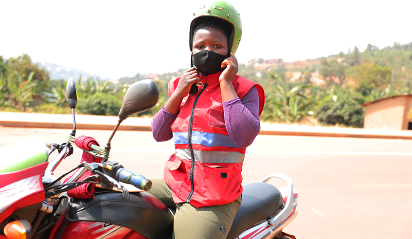 Marie Louise Karegeya a female motorcyclist in Kigali . / Sam Ngendahimana