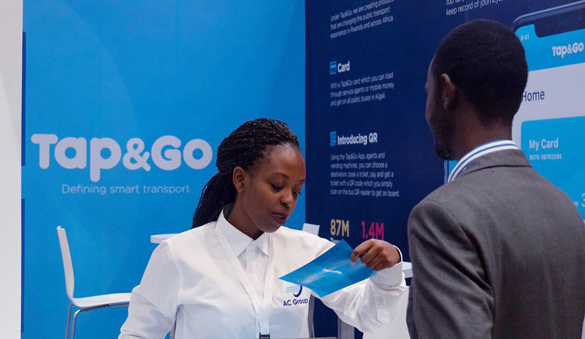 A staff takes a visitor through AC Group products during a mini-exhibition at Kigali Convention  Centre last year. The company is offering five-month paid maternity leave to employees. / Photo: Courtesy.