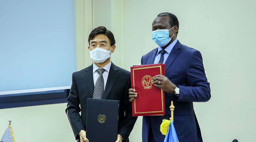 Amb. Jin-weon Chae representative of South Korea in Rwanda and Uziel Ndagijimana, Minister of Finance and Economic Planning after signing a 66,2 million dollar deal to support the country's development efforts on November 26, 2020. 