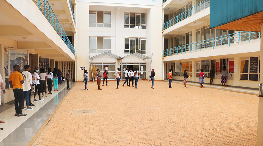 Mount Kenya University students observe physical distancing as they enter class in Kigali on Thursday, December 3. 