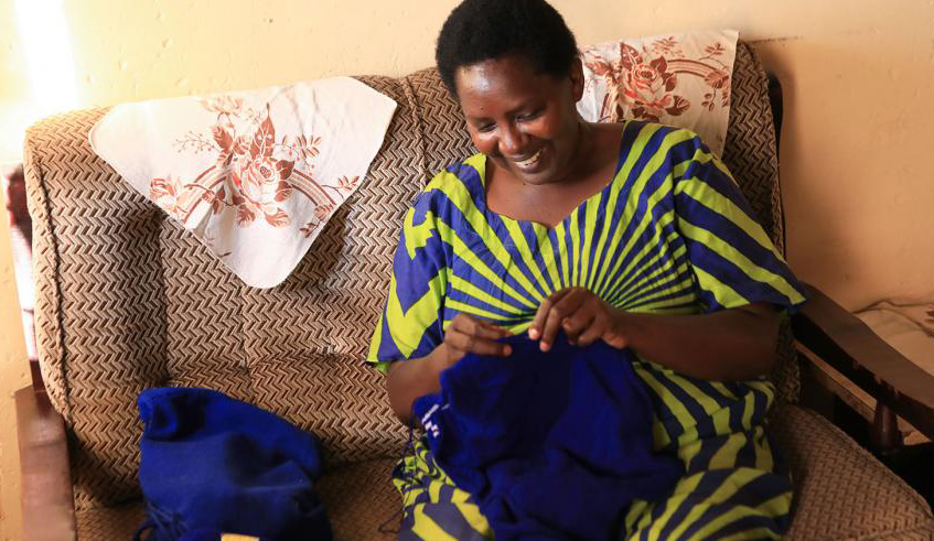 A visually impaired woman makes schools sweaters; she earns a living through tailoring. Women living with disabilities face challenges in both public and private spheres. / Photo: File