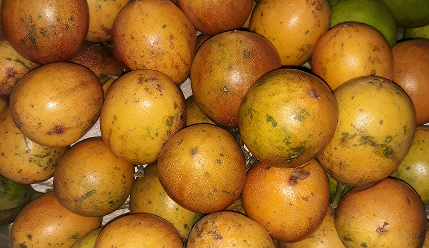 Yellow passion fruits for sale in a small market located in Zindiro, a Kigali suburb. / Photo: Lydia Atieno