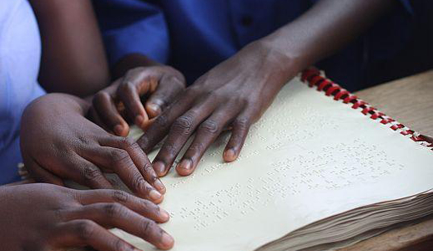 Visually impaired students using braille to read. / Net photo.
