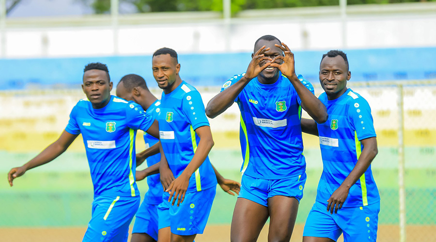 Alex Ortomal (2nd-R) celebrates with teammates after putting AS Kigali ahead just in the second minute at Kigali Stadium on Thursday. 
