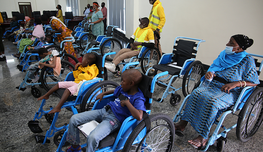 Singer Gahongayire through her charity organisation, Ndineza, donated wheelchairs to people living with disabilities . / Craish Bahizi