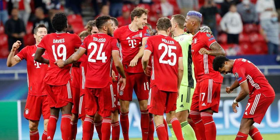 FC Bayern Munich players celebrate at the end of the Uefa Super Cup final match against Sevilla FC at the Puskas Arena in Budapest, Hungary on September 24, 2020. 
