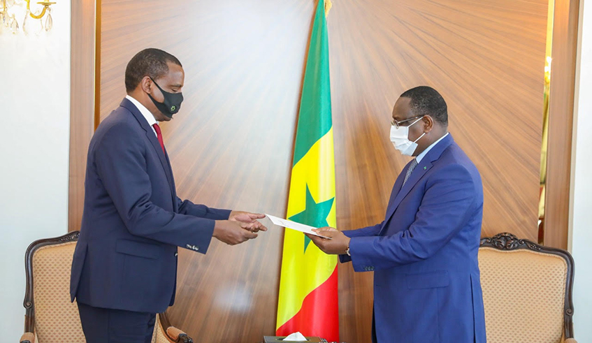 Amb. Jean Pierre Karabaranga (left), Rwandau2019s envoy to Senegal, presents letters of credence to President Macky Sall in Dakar on Tuesday, December 22. / Photo: Courtesy.