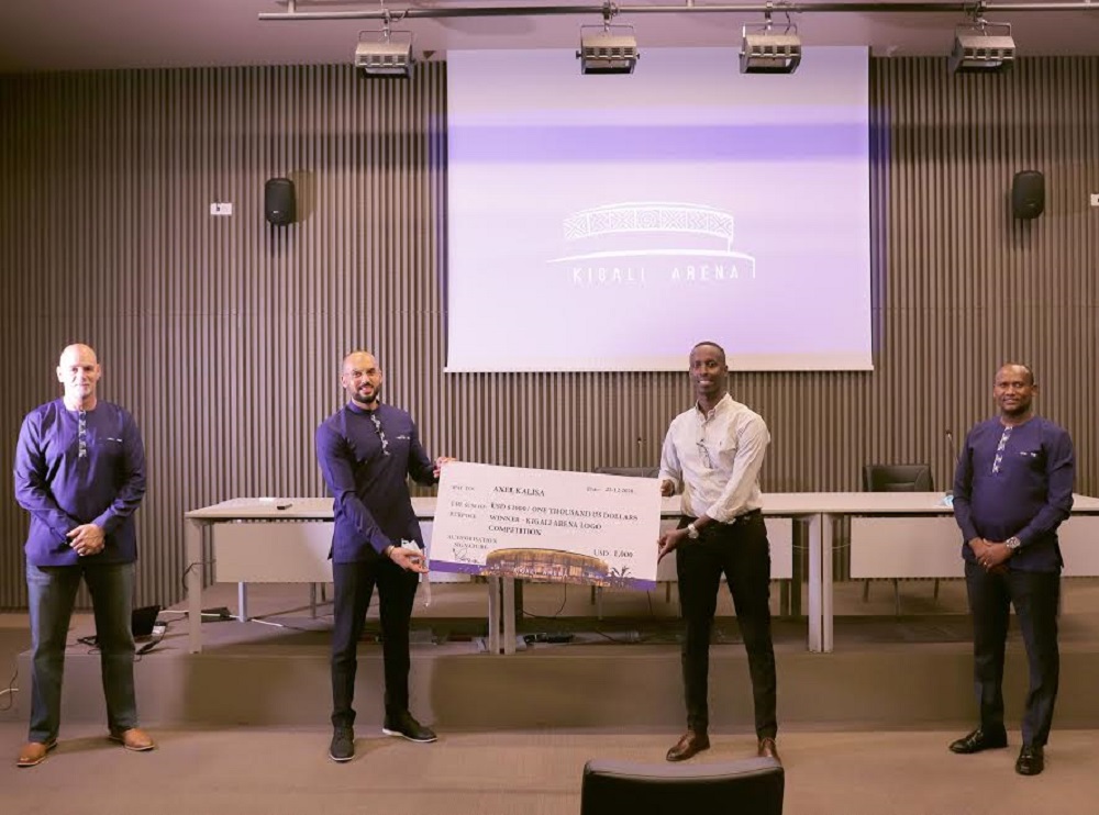 Axel Kalisa poses with the checque at Kigali Arena on Wednesday, December 23. / Courtesy