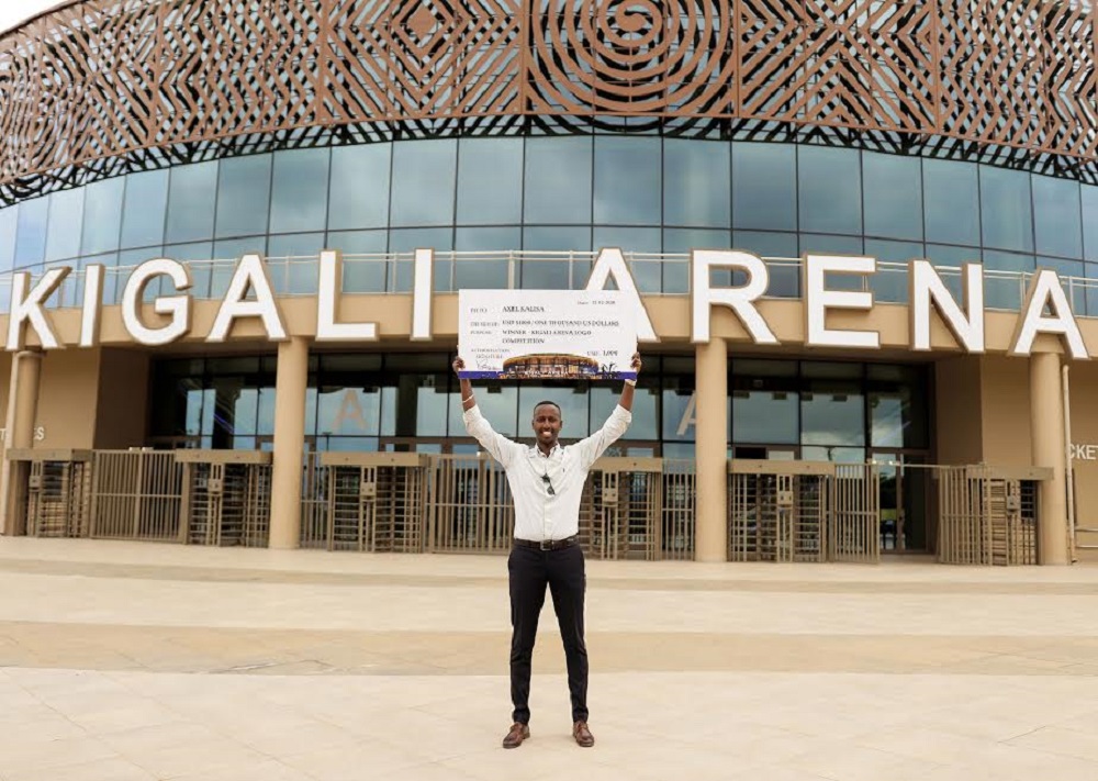 Axel Kalisa poses with the checque at Kigali Arena on Wednesday, December 23. / Courtesy