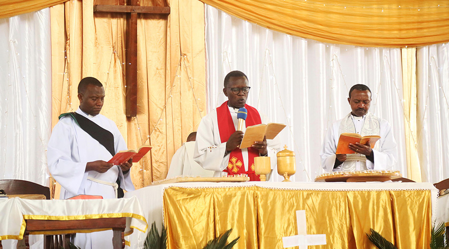 Reverend Canon Antoine Rutayisire leads other clerics during a holy communion service at Remera Anglican Church on Christmas last year. 