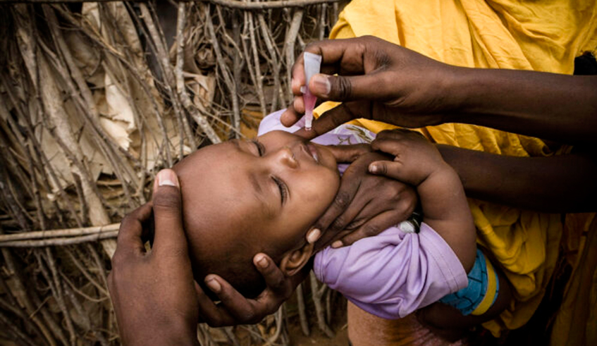 A child gets vaccinated for polio by a community health worker. In August, the World Health Organization (WHO) declared that Nigeria, the last country in Africa to suffer from wild polio, has finally eradicated the virus. / Net photo.