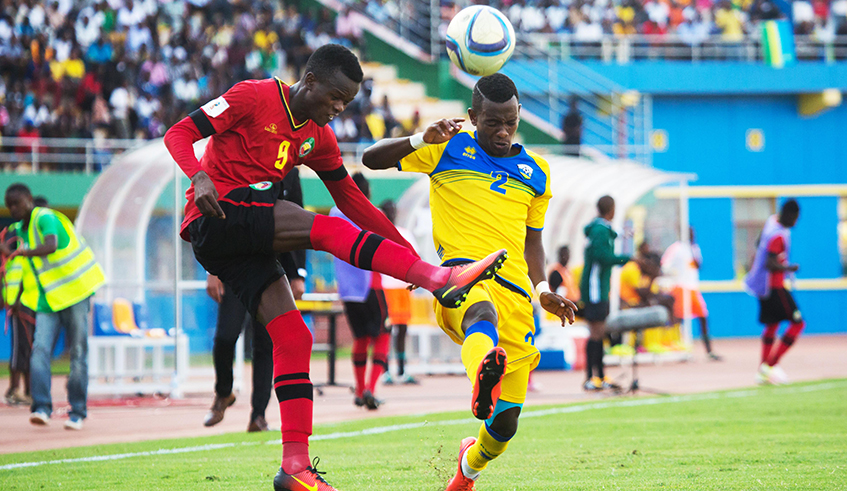 Amavubi right-back Michel Rusheshangoga tries a header during a past match against Mozambique at Amahoro National Stadium in Kigali. / Sam Ngendahimana.