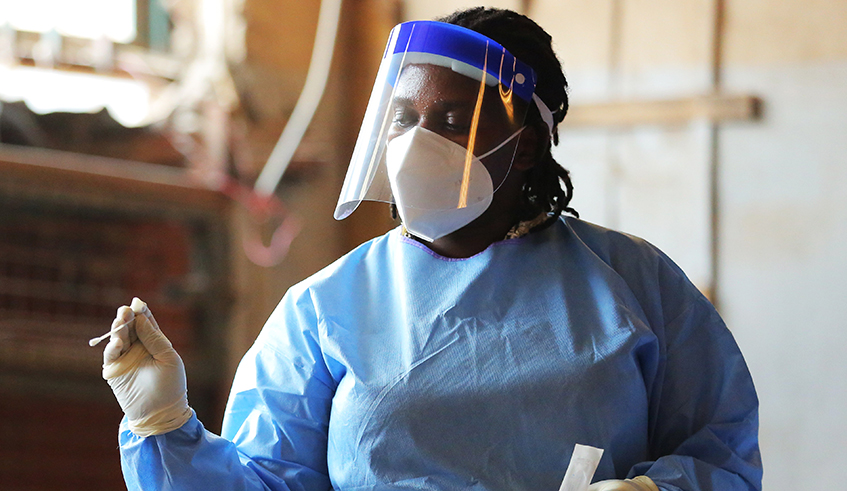 A frontline worker during a Covid19 testing exercise in Kigali. / Net photo.