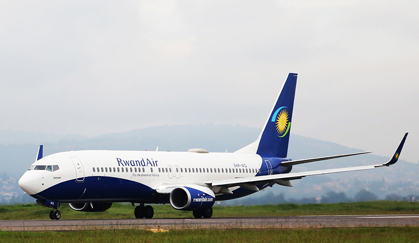 A RwandAir  plane on the runway at Kigali International Airport. When Covid-19 hit, the carrier suspended all commercial flights, and it was only in August that it resumed operations. / Photo: Sam Ngendahimana.