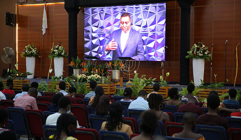 Believers follow Apostle Paul Gitwazau2019s sermon at Zion Temple Celebration Centre in Gatenga, Kigali on Christmas Day. Thanks to Covid-19 curfew and other restrictions, churches are looking to leverage virtual event platforms such as Zoom and YouTube to hold their traditional New Yearu2019s Eve prayers. / Photo: Craish Bahizi.  
