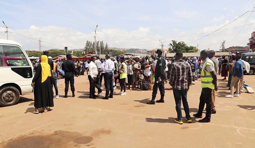 Hundreds of passengers stranded at Nyabugogo Taxi Park in Kigali, after the Government decided to suspend inter-district travel effective Tuesday, January 5. / Photo: Craish Bahizi.