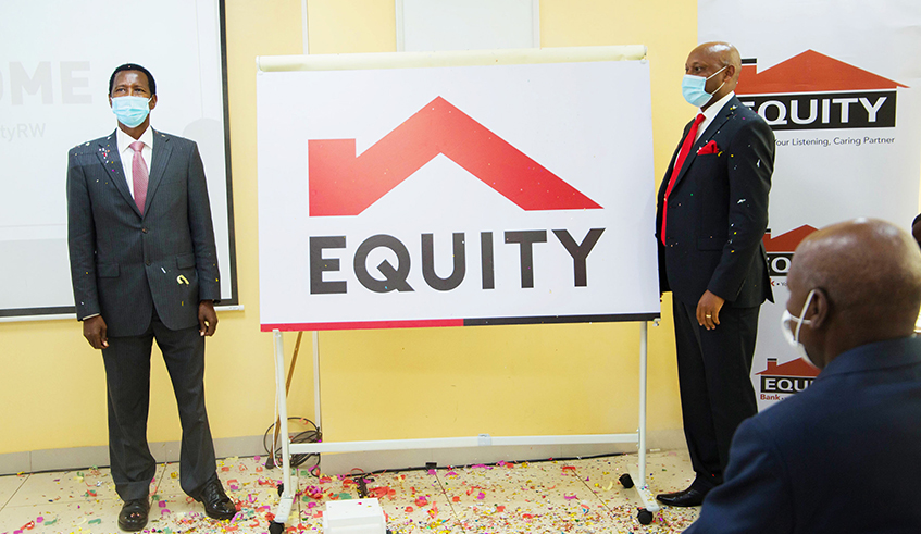 Patrick Uwizeye, Board Director (left), and Hannington Namara, Managing Director, Equity Bank Rwanda, unveil the banku2019s new logo in Kigali on December 30. / Photo: Dan Nsengiyumva.