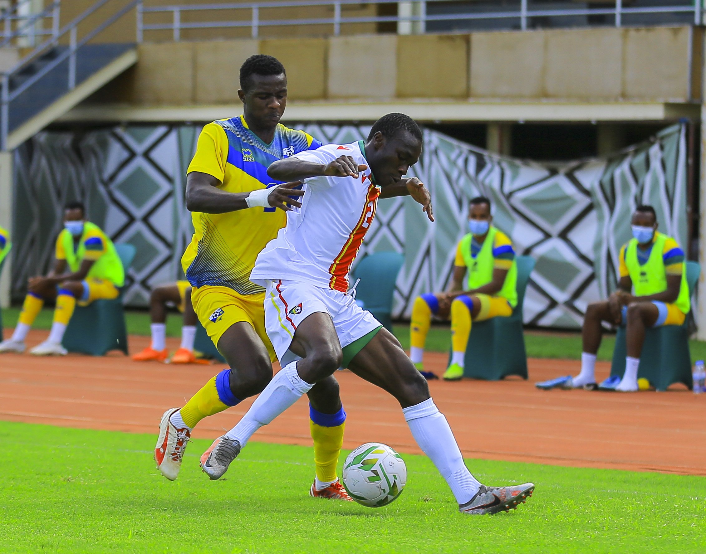 Rwandan defender Emmanuel Imanishimwe challenges a Congolese player for the ball during the 2-2 draw at Amahoro Stadium on Thursday, January 7. 