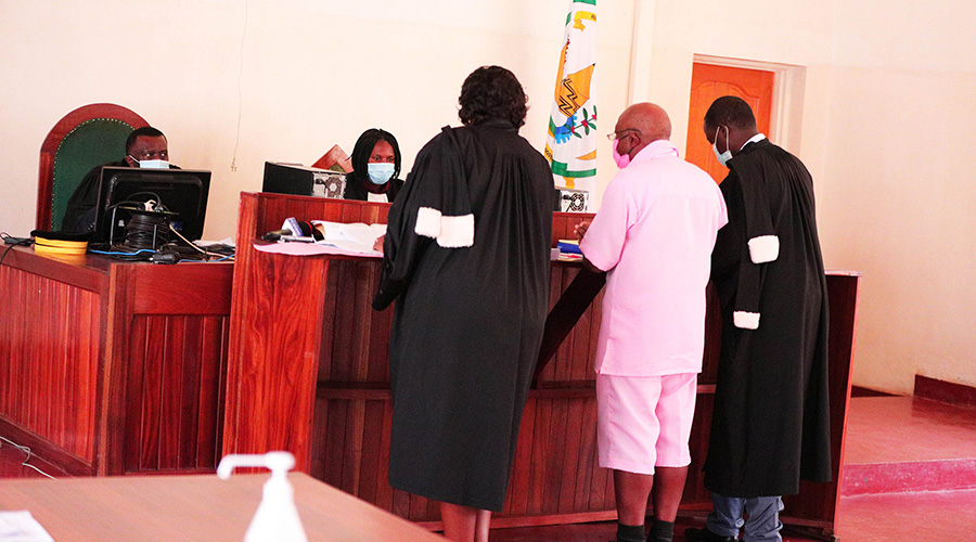 Paul Rusesabagina with his lawyers during a hearing at Nyarugenge Intermediate Court in September last year. 
