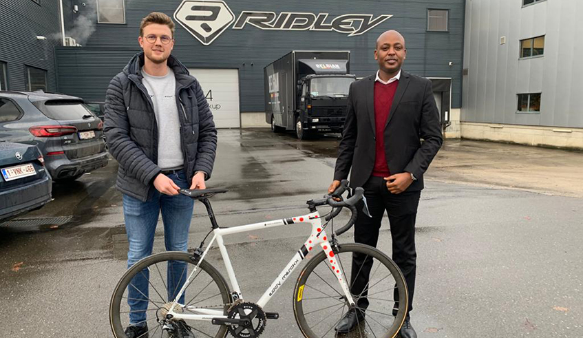 Abdallah Murenzi, the President of the federation (R) poses for a photo at Ridley Bikes factory which is expected to sign a deal with the Cycling federation to provide cycling equipment and bikes. / Courtesy.
