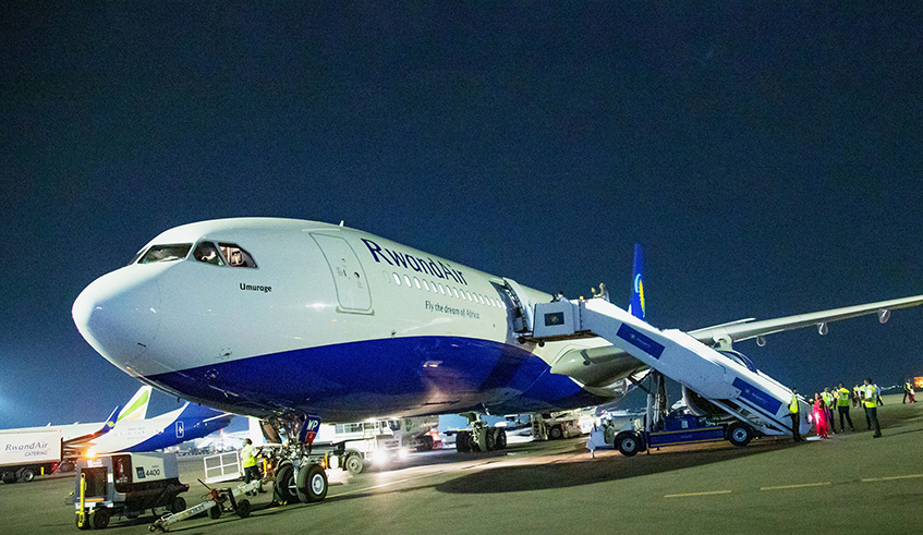 A RwandAir plane at Kigali International Airport. Like most other countries, Rwanda has put in place a raft of measures to help prevent the spread of Covid-19 and this has impacted the travel industry. / Photo: Sam Ngendahimana. 