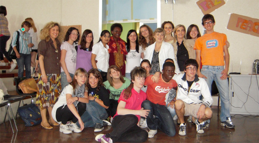 Yolande with youth in Italy after giving her testimony.