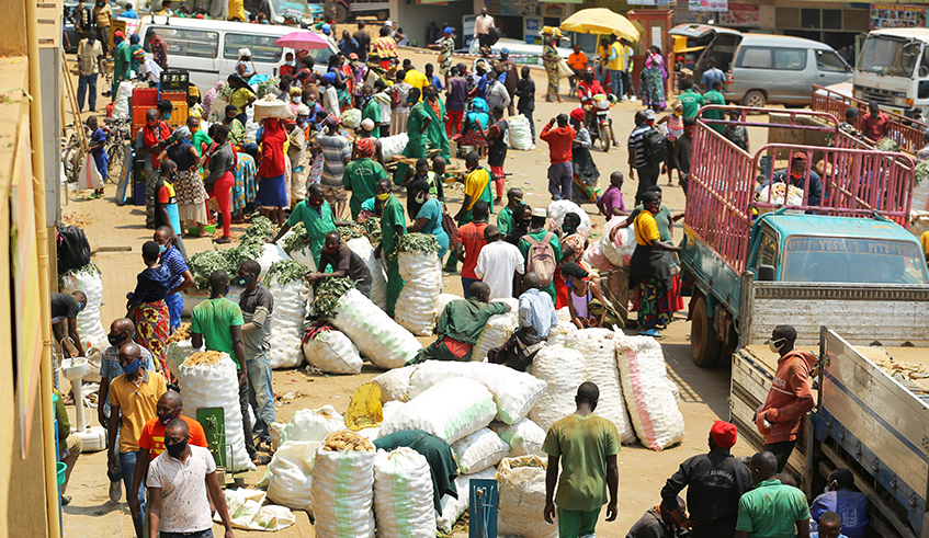 Vendors collect food stuff from upcountry at Nyabugogo Market in July last year. City of Kigali food sellers have raised concerns over the slump in supply food. / Photo: Dan Nsengiyumva.
