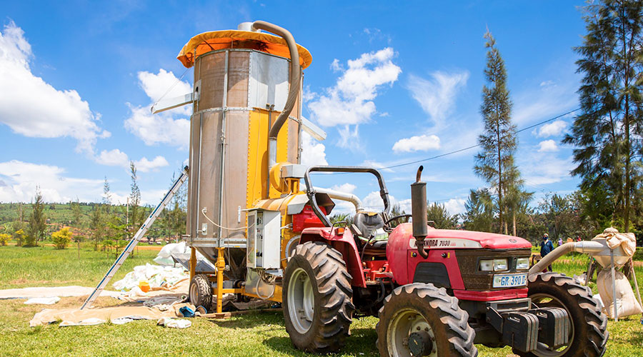 A mobile dryer connected to a tractor as it dries cereals. Such machines are expected to boost Rwandau2019s proper harvest handling efforts. 