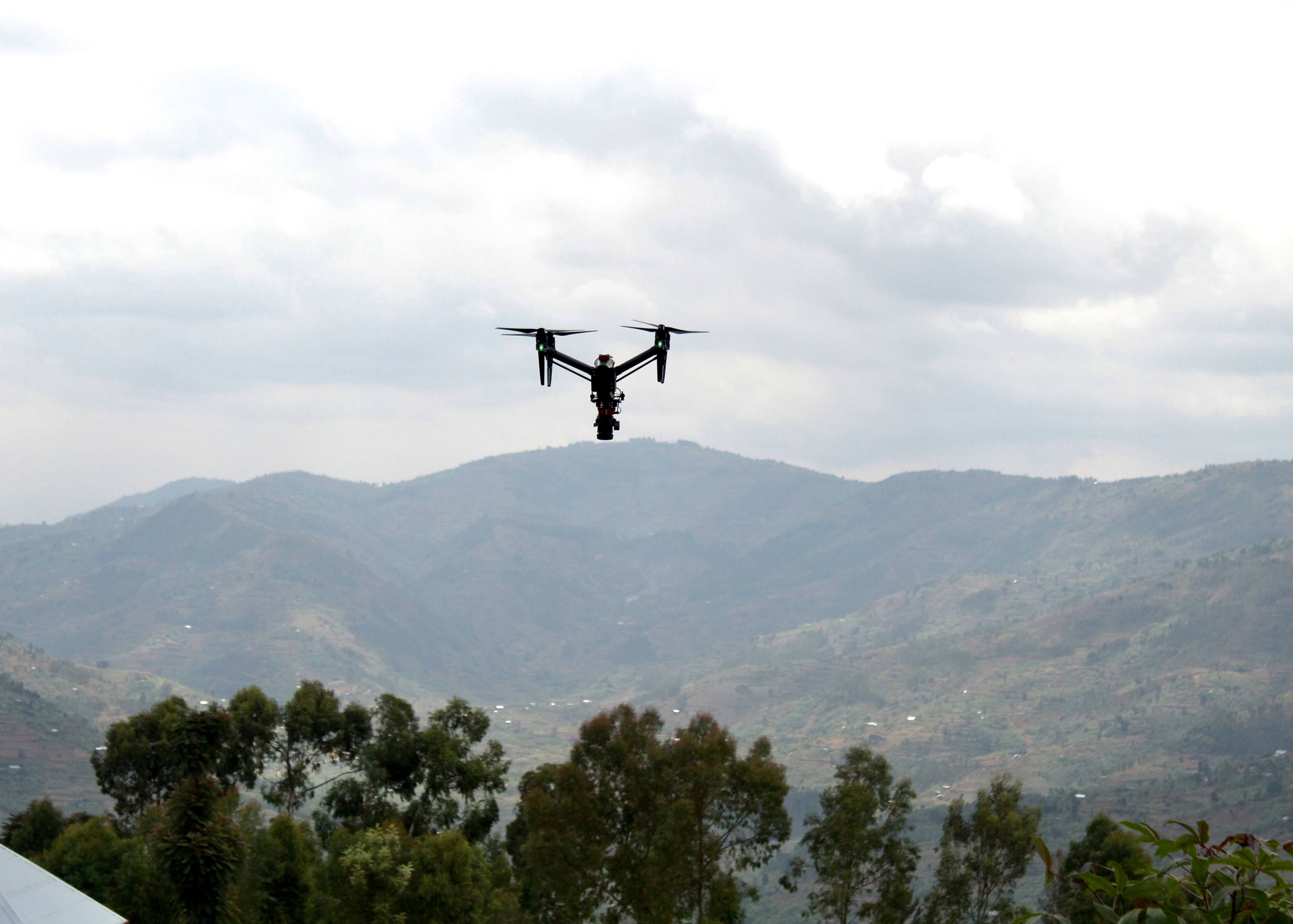 Charis UAS Drone Landscape - A drone takes flight over the iconic hills of Rwanda. Charis UAS drones are used to capture high-quality images of landscapes, giving complete and unique aerial views.