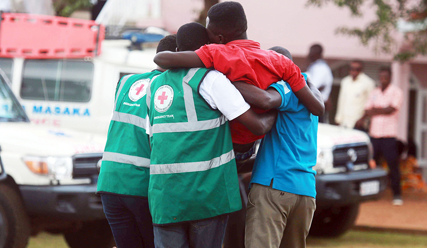 Volunteers help a trauma victim during a Genocide commemoration event at the Kicukiro-Nyanza Genocide memorial in  May 2019. The impact of the Covid-19 pandemic on peopleu2019s mental health is a fuelling concerns globally. /  Photo: Sam Ngendahimana. 