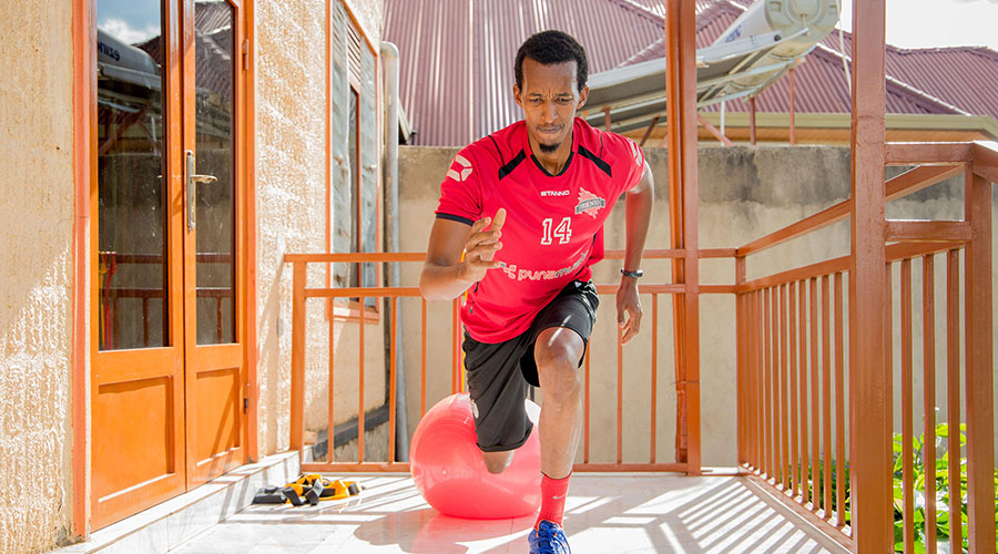 A Kigali resident does fitness exercises at home during the previous lockdown back in April 2020. 