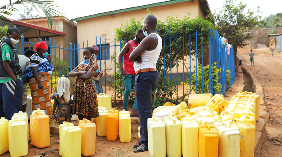 Residents draw water. Many households around the country are still grappling with water shortage. 