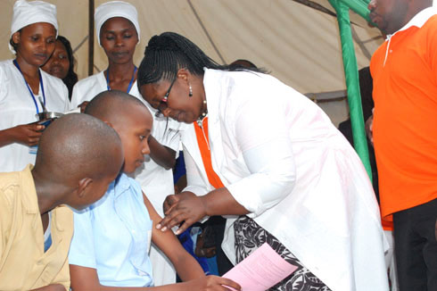 Heath workers vaccinate schoolgirls against cervical cancer in Nyanza District in 2013. 