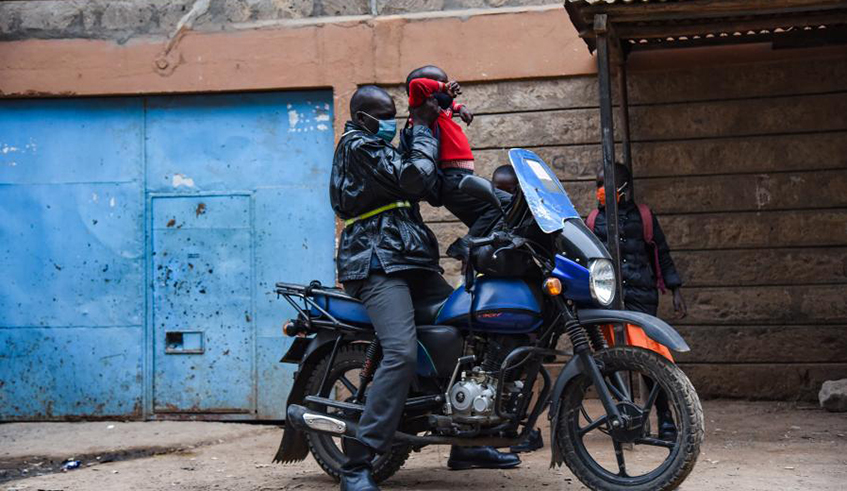 Moses Otieno prepares to send his children to schools in Nairobi, Kenya, on Jan. 22, 2021. (Xinhua/John Okoyo)