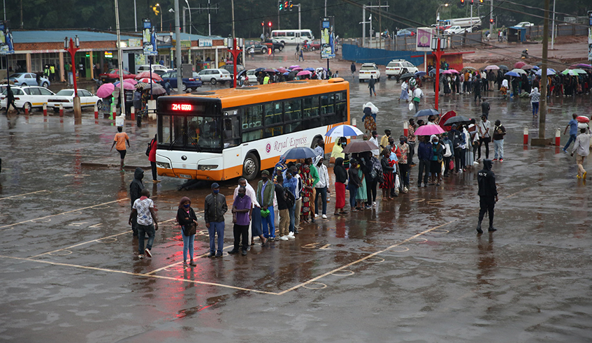 Passengers wait for public bus at Nyabugogo Taxi park.