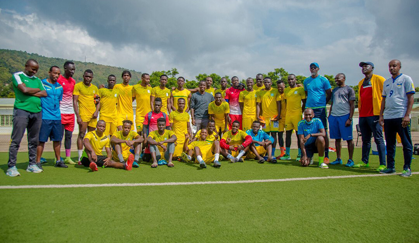 AS Kigali players and staff pose for a group photo at Kigali Stadium in January 2021. The clubu2019s name is set to be changed to Kigali Football Club this year. / File.